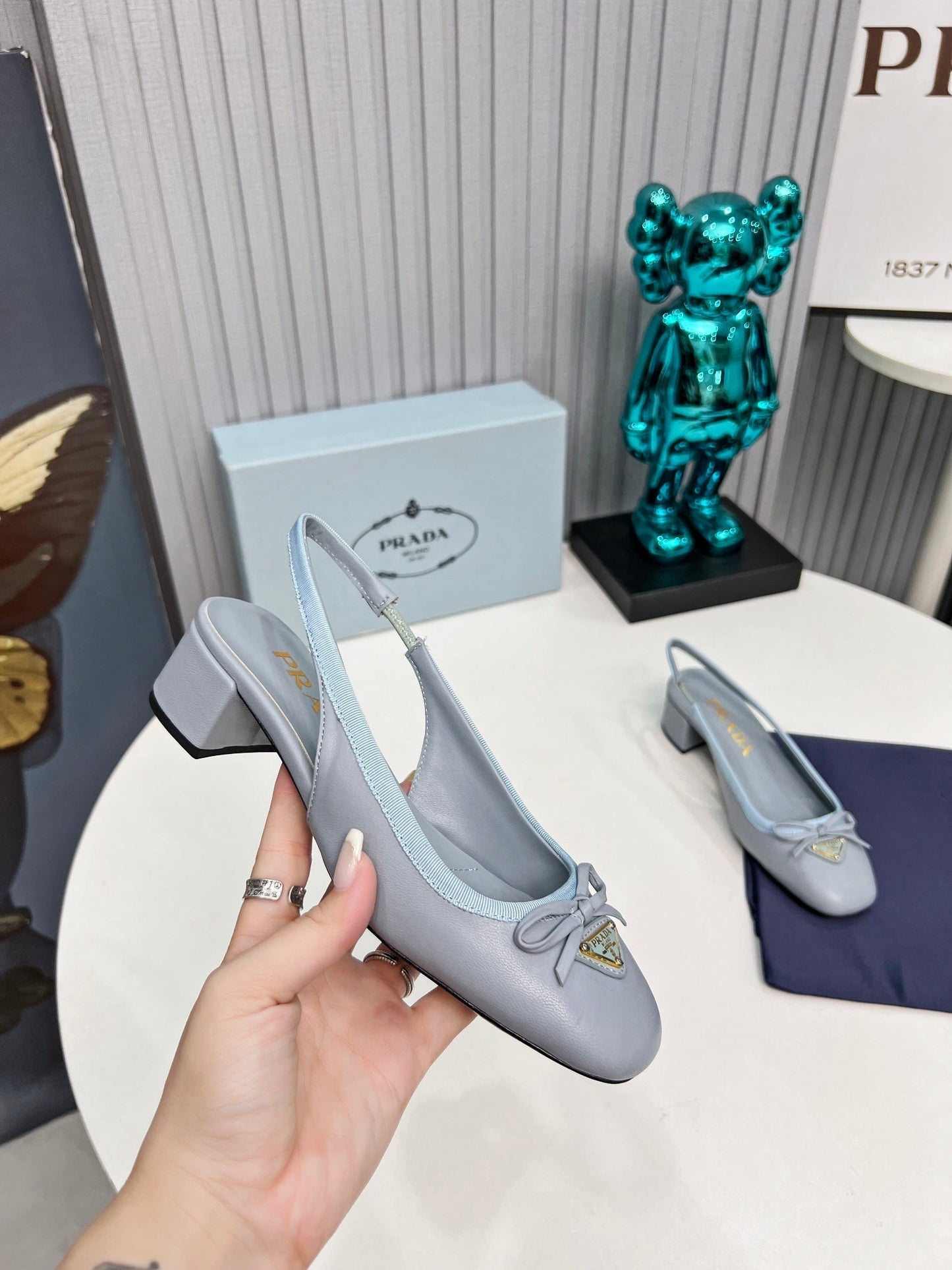 Prada 26s Round Toe Slingback Pumps 40mm In Light Blue Calfskin With Bow