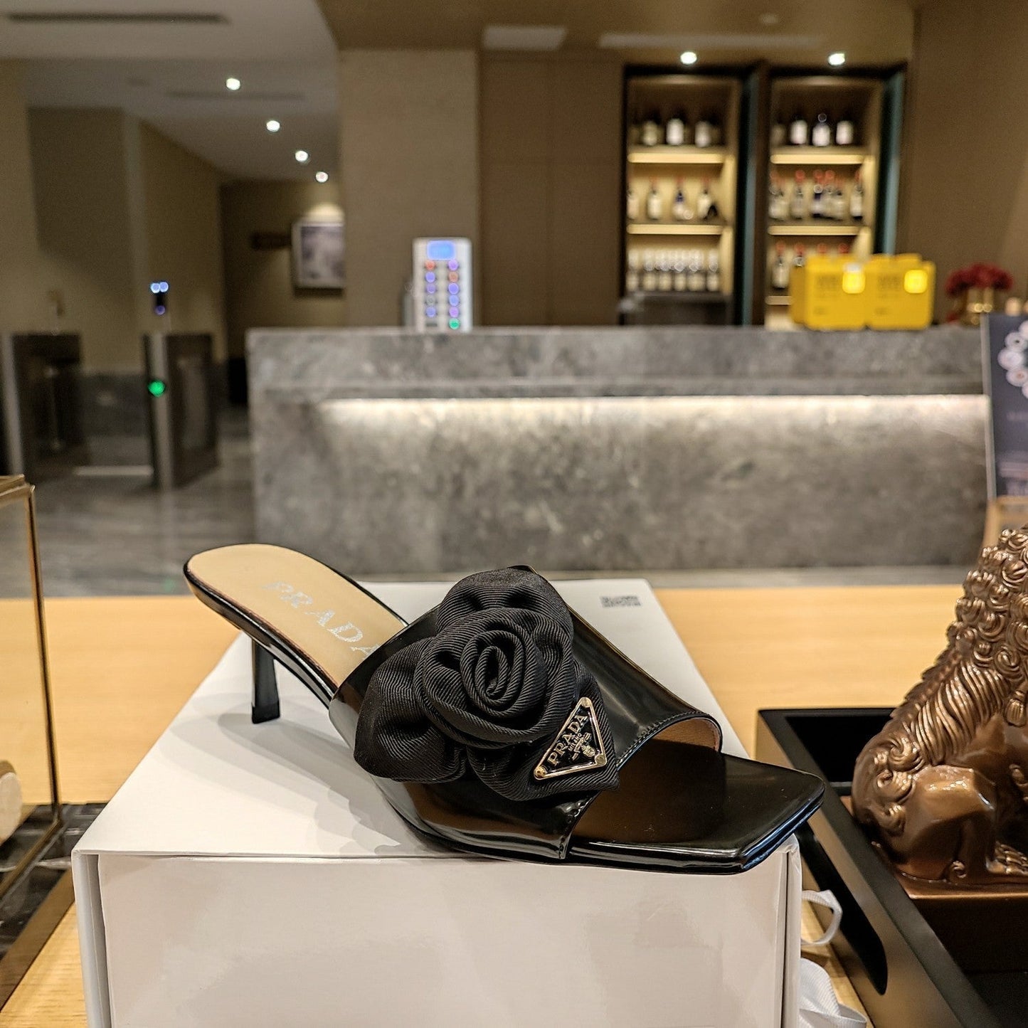 Prada 26s Open Toe Mules 45mm In Black Patent Calfskin With Rosette