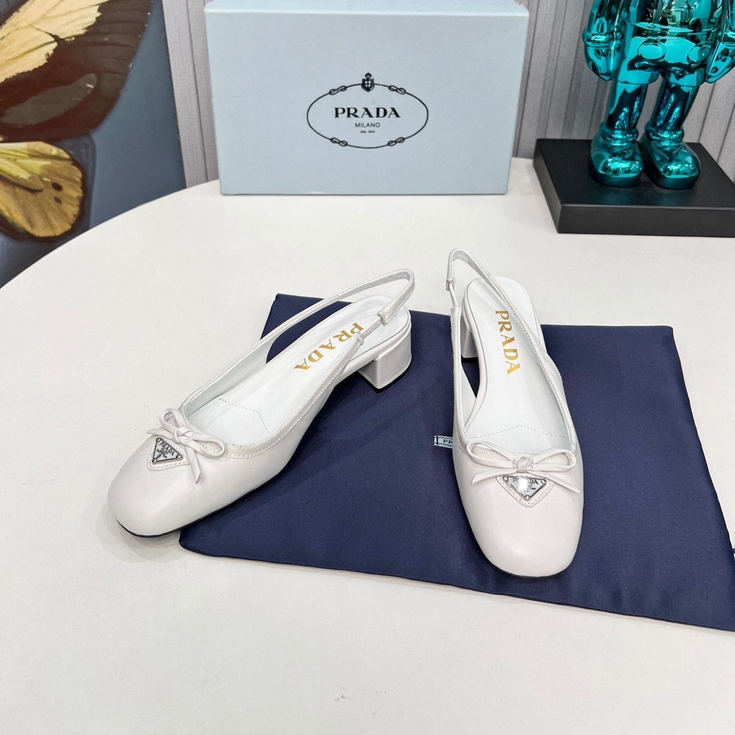 Prada 26s Round Toe Slingback Pumps 40mm In White Calfskin With Bow